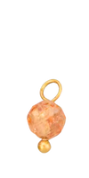 Light orange bead in gold